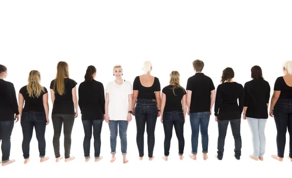 People in a row with one of them facing the camera