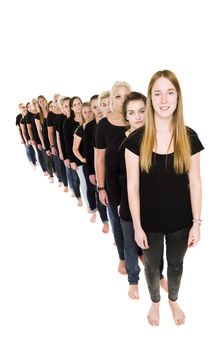 Large group of young women in a line isolated on white background