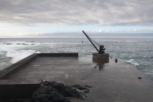 Small deserted quay in the coast of Pico island, Azores