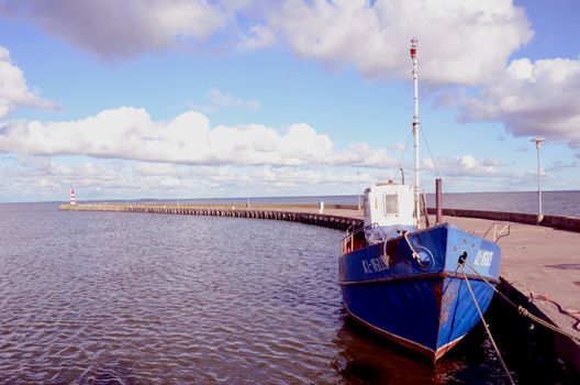 Small fishing boat moored at the jetty.