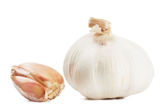 Closeup view of garlic isolated on white background.