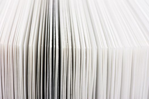 Macro view of pages of thick book