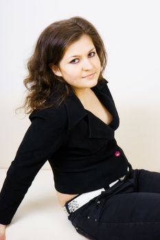 attractive sexy brunette in a dark suit
