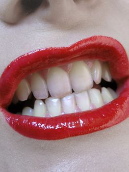 Teeth and lips with red lipstic
