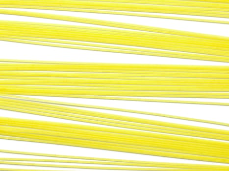 raw spaghetti noodles isolated on white