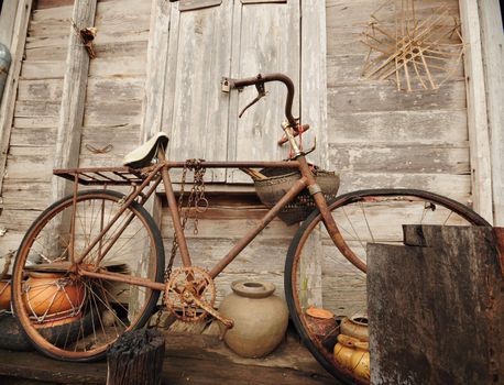 Old Bicycle and old wood house