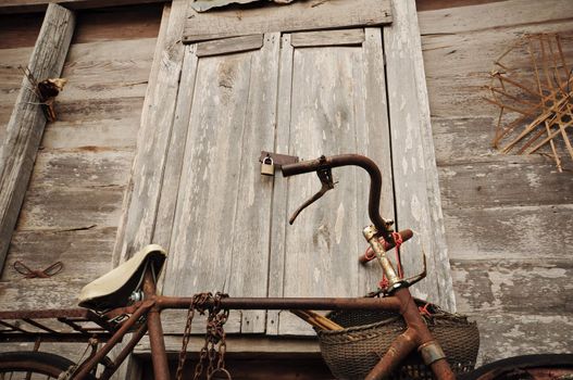Old Bicycle and old wood house