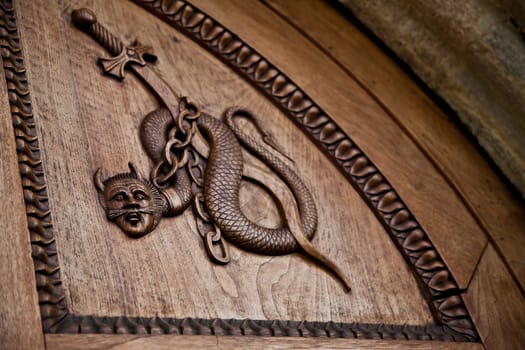 Medieval demon on antique door- Sacra di San Michele (St. Michael Abbey) - Torino - Italy