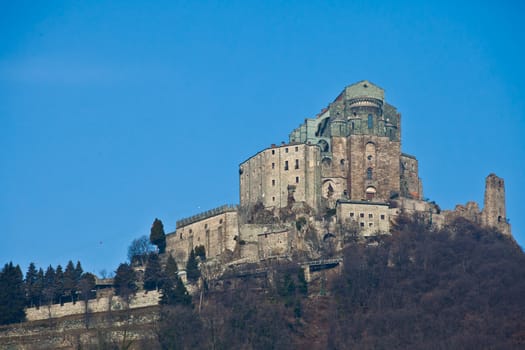 Abbey of 11st century, Piedmont region, Italy. The church, whose construction lasted for many years, is characterized by the unusual position and architecture.