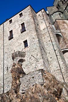Abbey of 11st century, Piedmont region, Italy. The church, whose construction lasted for many years, is characterized by the unusual position and architecture.