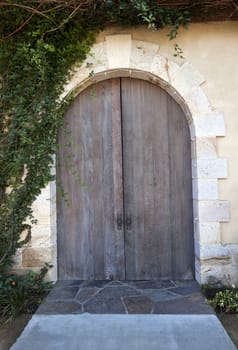 An old doorway with a pair of wood doors