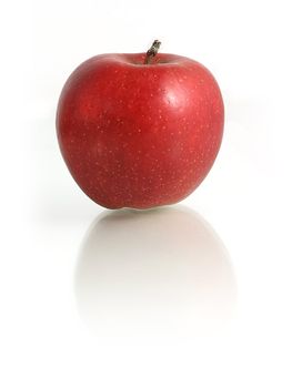 Red Apple on white mirroring background