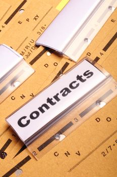 contract word on business folder showing trade or financial concept