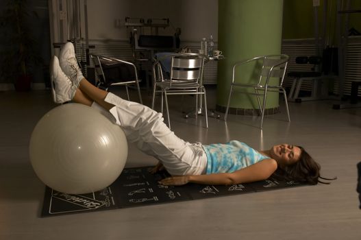 Woman practices and resting in Gym