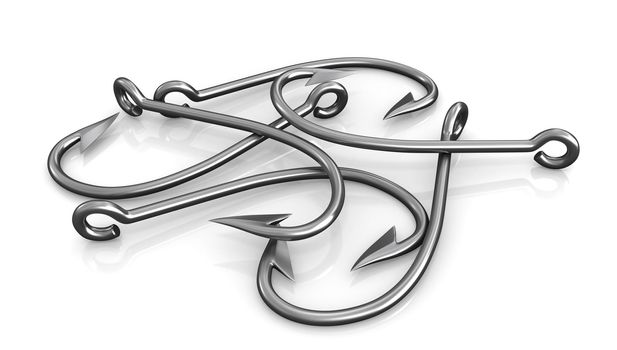 Few steel fishing hooks isolated on white background