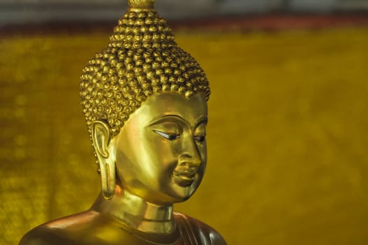 face of golden buddha statue