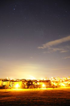 night sky with stars over the town or city and copyspace