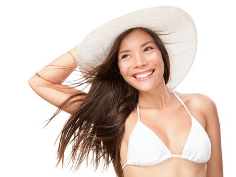 Summer bikini girl isolated. Portrait of young summer woman smiling in white bikini and beach hat. Fresh and pretty Mixed race Asian Caucasian model isolated on white background.