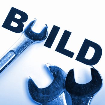 build and tools showing construction concept with word