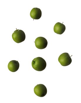 tossed green apples in the air