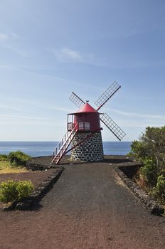 Red windmill in the coast of Pico island, Azores