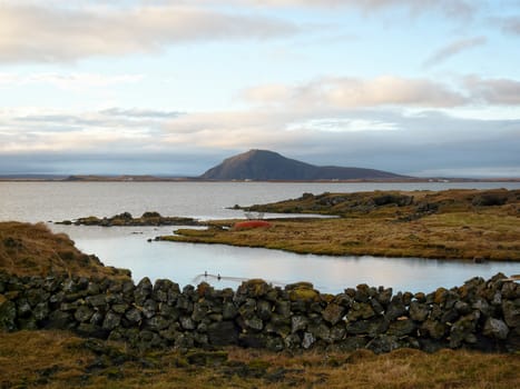 Small boat at the border of Lake Myvatn in the north of Iceland.