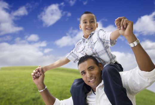 Hispanic Father and Son Having Fun Together in the Park.