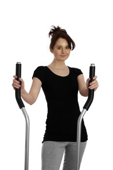 young woman exercising on stepping machine