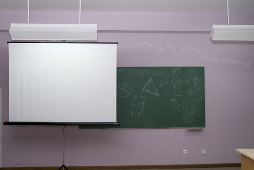 Classroom interior,with  panel and  projection screen.