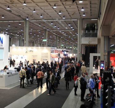 People visit technologies stand during SMAU, international fair of business intelligence and information technology in Milan, Italy.