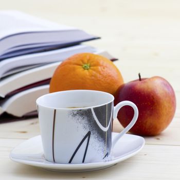 cup of coffee, books and fruits