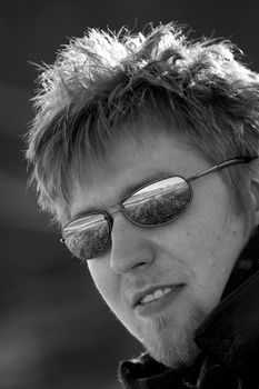 Outdoor portrait of a man with sunglasses