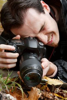 Nature photographer shooting macro in the forest