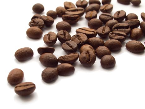 Roasted coffee beans on white background