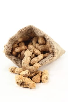 a bag filled with peanuts on a white background