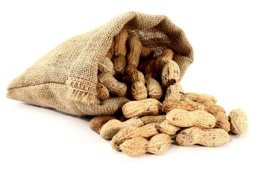 a bag filled with peanuts on a white background