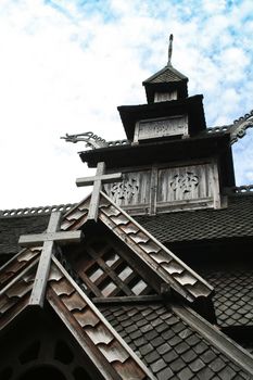 the old wooden norwegian church with crosses