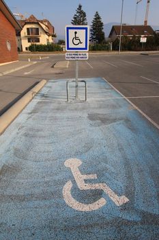 Blue parking space with icon for disabled persons