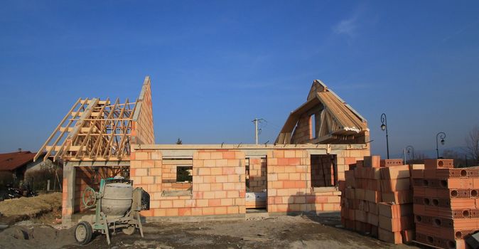 Small residential house under construction by beautiful weather