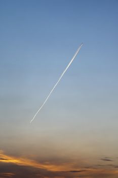 An image of a plane in the morning sky