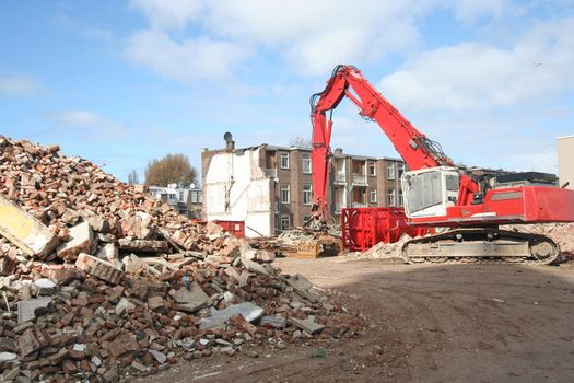 Demolition bulldozer at urban renewal construction site