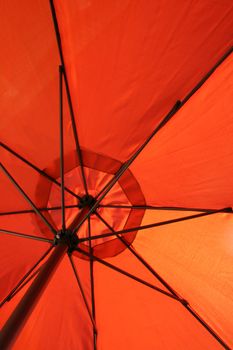 the orange umbrella protect from sun and rain