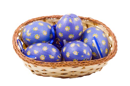 a basket of blue easter eggs isolated on the white background