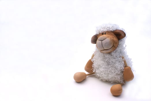 A curly sheep against white background.