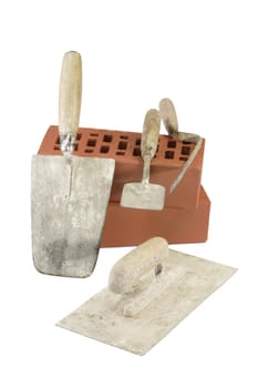 Various types of trowels and red bricks - isolated on white background
