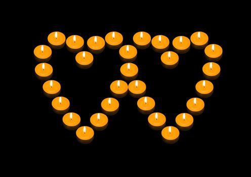 a group of burning candles forming two joint fiery hearts
