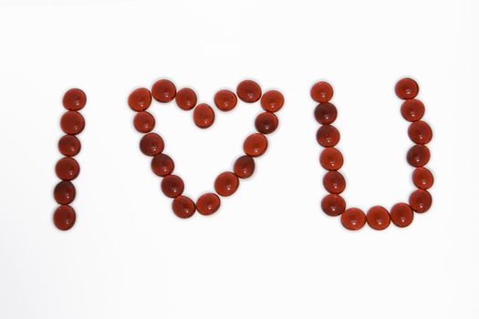 I love you spelt out in red gemstone