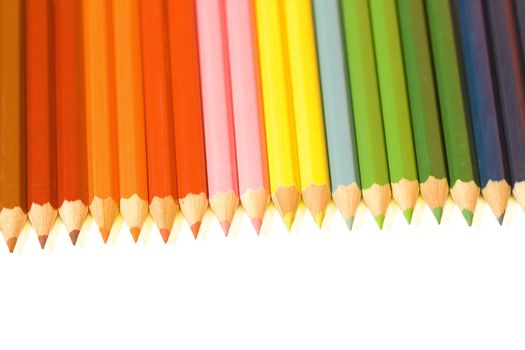 Coloured crayon rainbow on white background