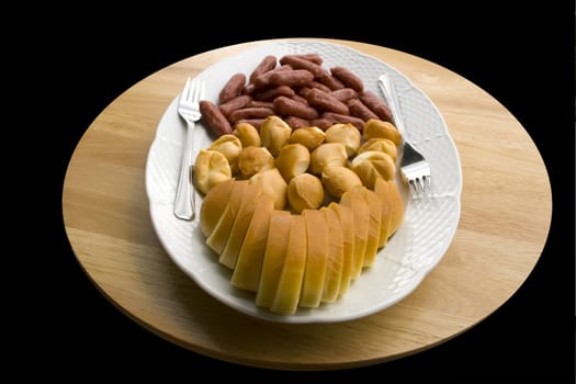 A plate of cheese and sausages - close up