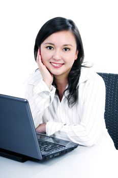 Portrait of an attractive young businesswoman with laptop, over white background.